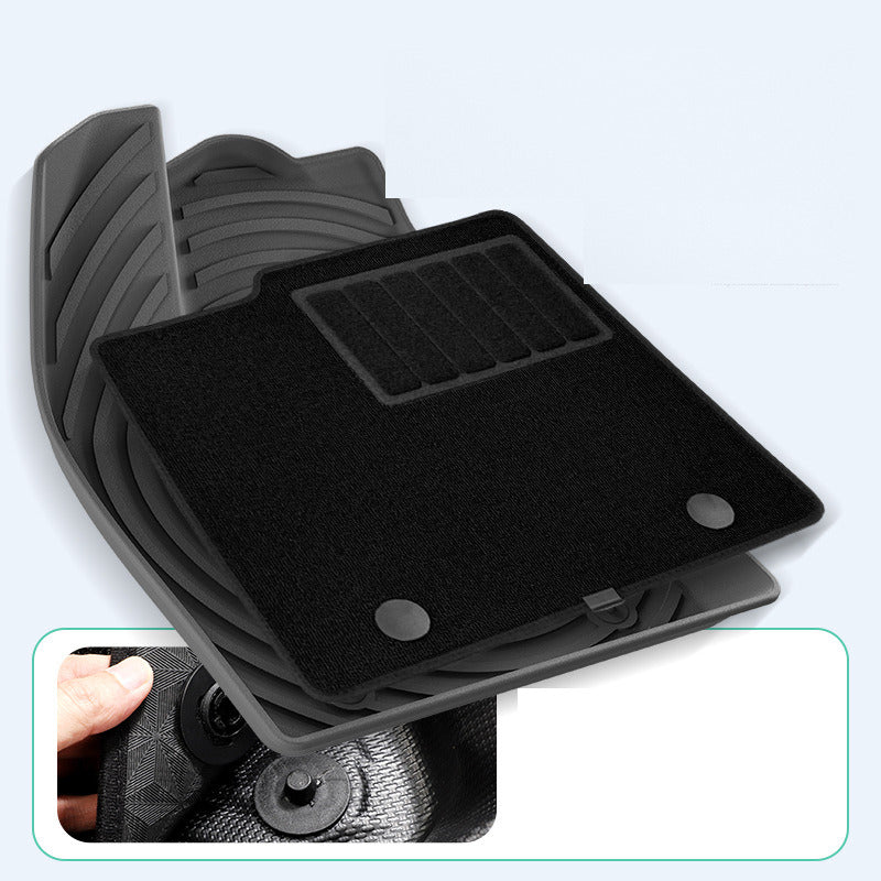 Carpet layer lifted from the mat, showing the clip attachment