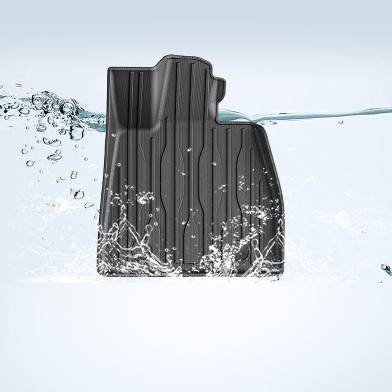 BYD Seal floor mat being rinsed clean in water