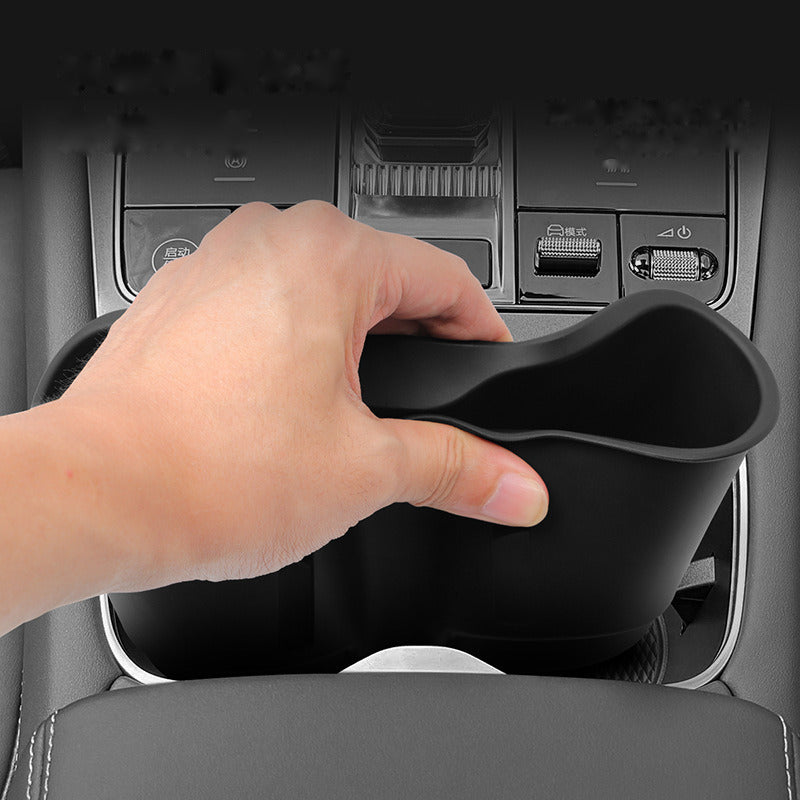 Dropping the cup holder insert into place by hand