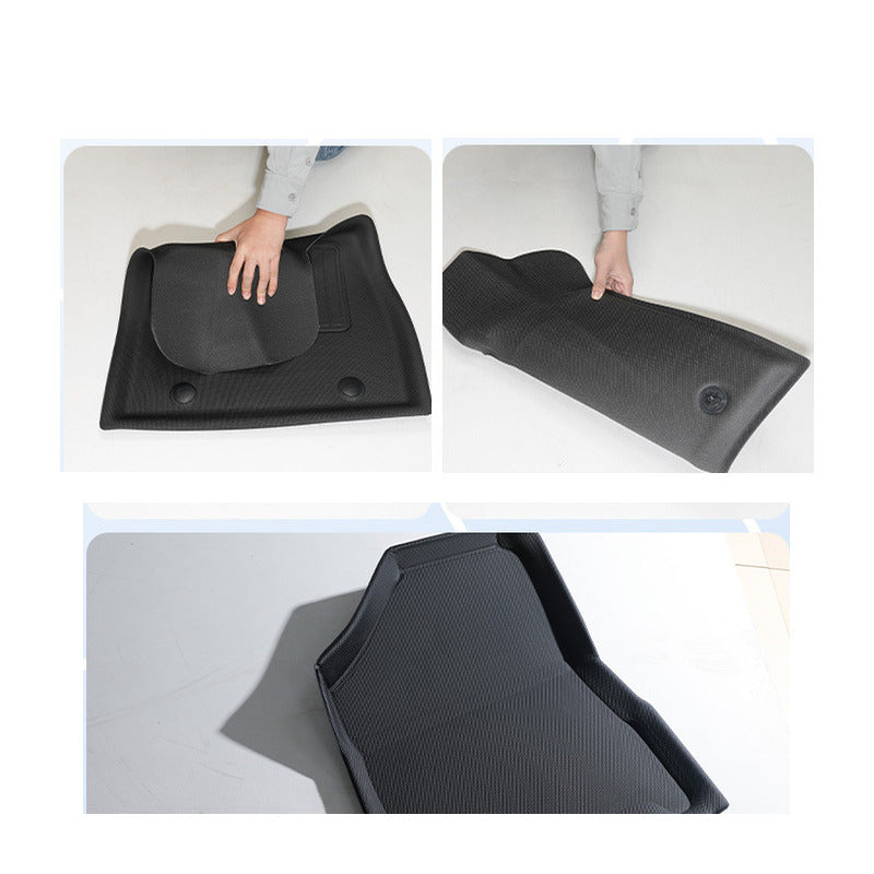 BYD Sealion 8 floor mats being bent by hand to show they flex and spring back