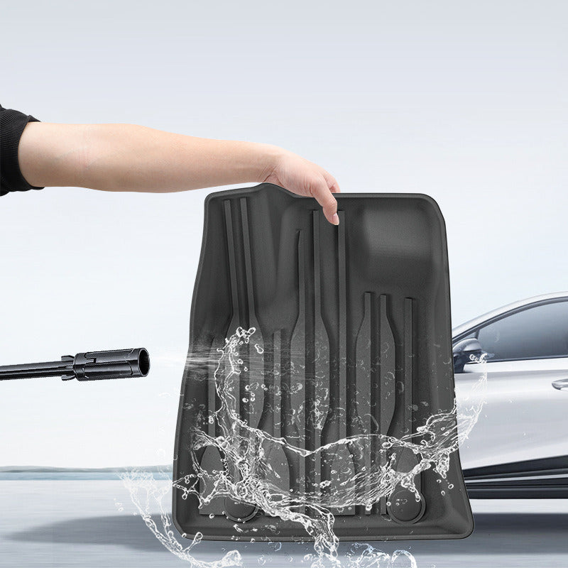 BYD Shark 6 floor mat being rinsed clean under running water