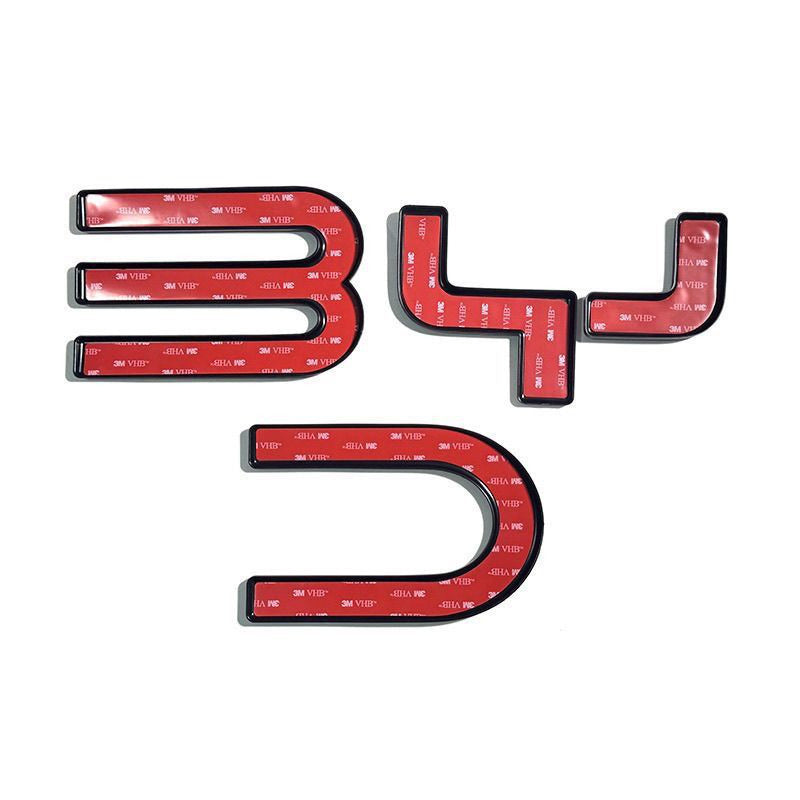 Back of the badge letters with adhesive tape