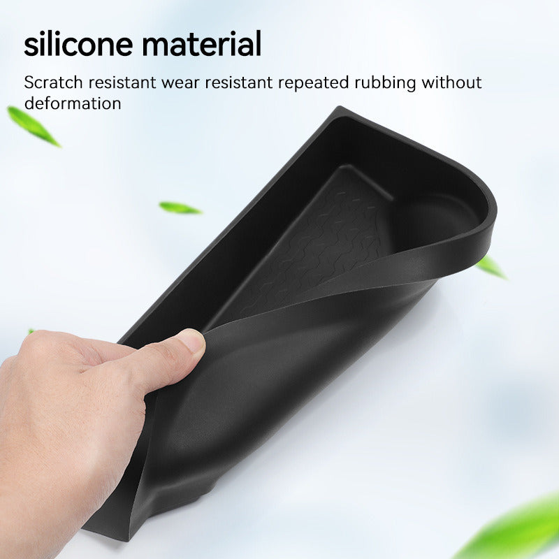 Silicone storage box bent by hand to show it is flexible