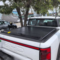 Roller lid tonneau cover closed on a white BYD Shark 6