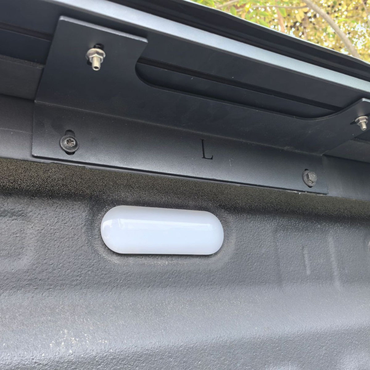 Close-up of the tonneau cover side rail and mounting bracket