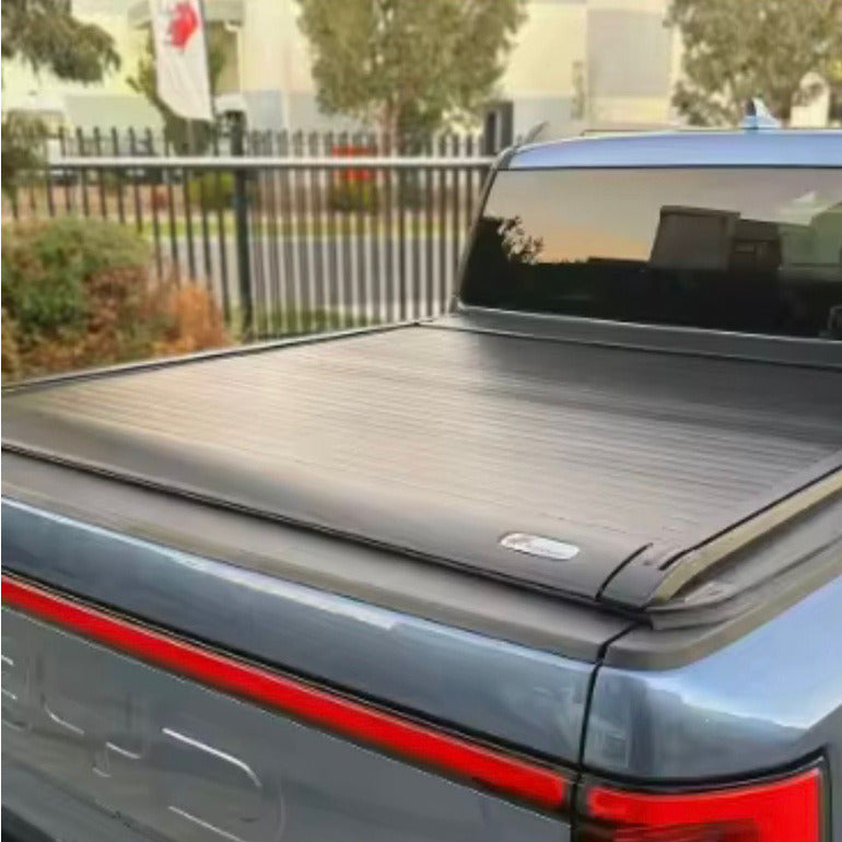 Electric roller lid tonneau cover closed on a grey BYD Shark 6