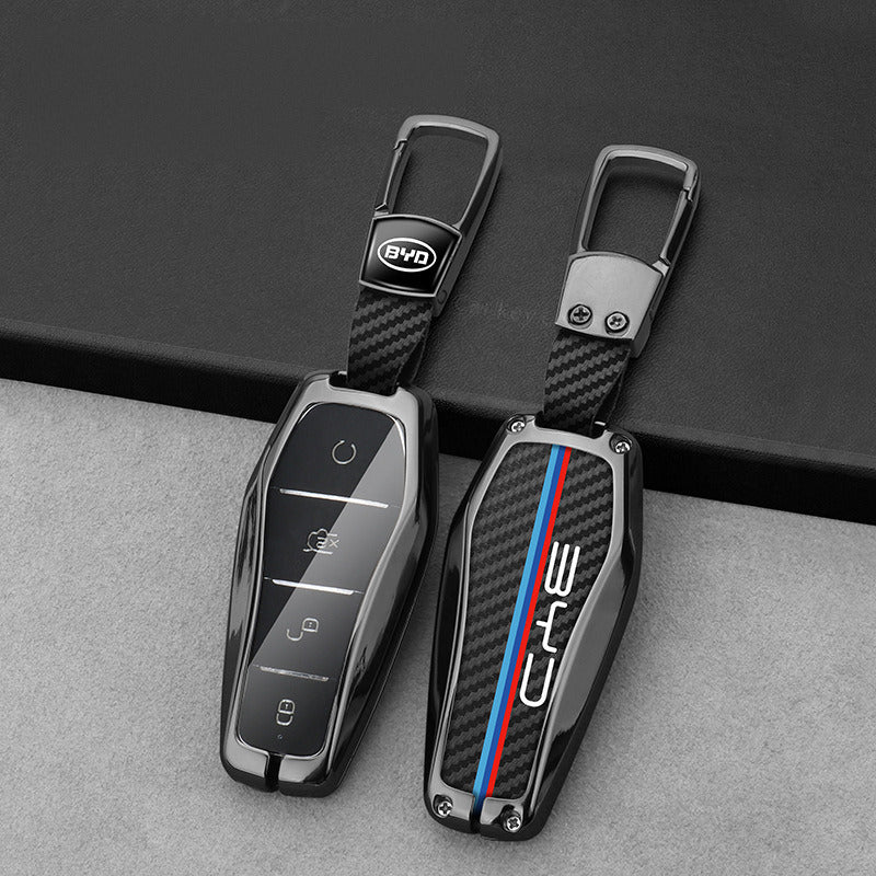 BYD key cases with clear fronts and carbon-look backs, with BYD keychains